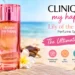 Clinique My Happy Lily of the Beach Perfume Spray on a tropical beach-inspired setting.